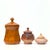 Brown-lidded containers, group of 3. A stunning set of lidded ceramic and stone containers in different shades of brown....