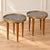 A charming matched pair of French marble-top occasional tables featuring richly patterned gray marble, pierced brass...