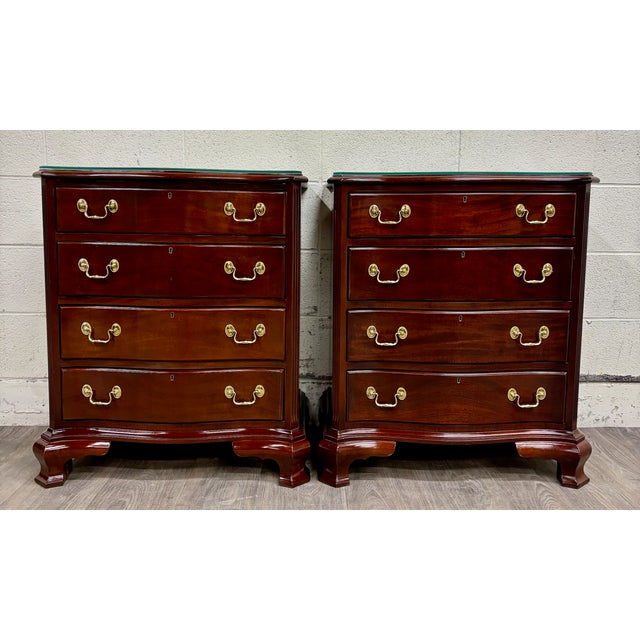 This is a gorgeous pair of vintage Councill Furniture solid mahogany Chippendale four drawer nightstands or bedside tables...