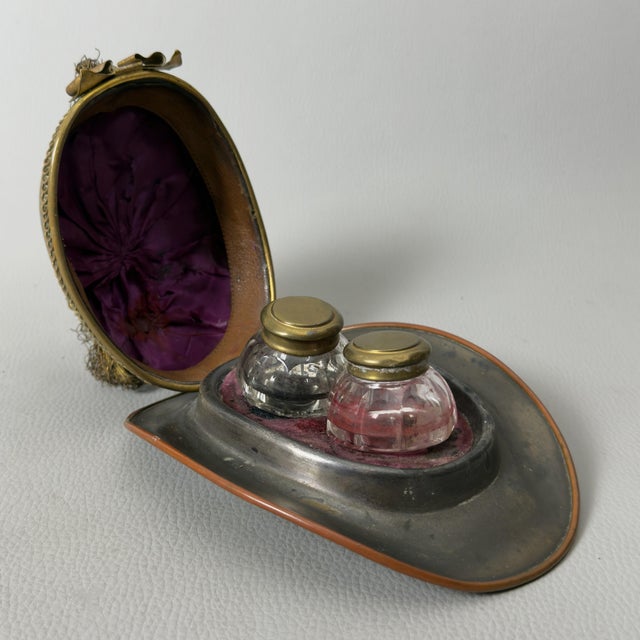 A rare and fascinating vintage inkwell dating back to the early 1900s (world war i period, 1915-18). It is likely a piece...