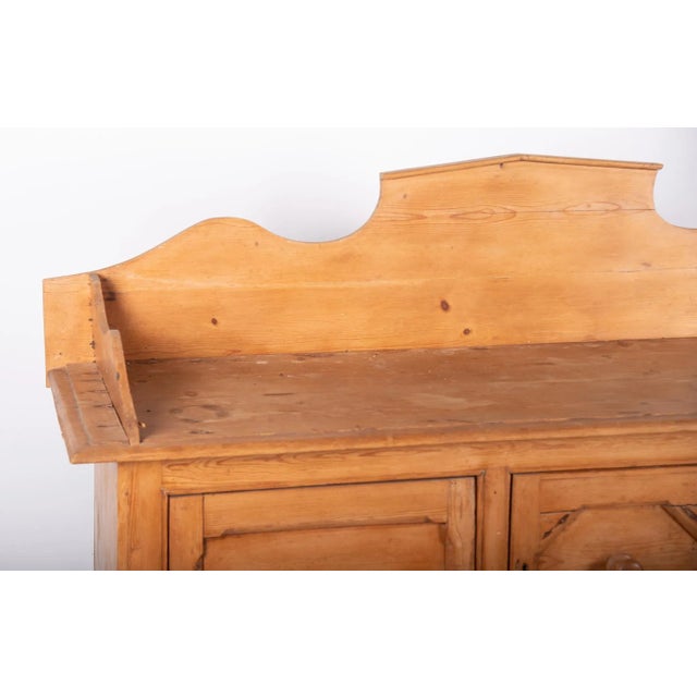 Antique English Pine Cabinet Three-quarter shaped gallery above a pair of cupboard doors flanking a pair of small center...