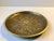 Art Deco bronze bowl or small charger with four clover motif surrounded by floral decorations - all in relief. It is...