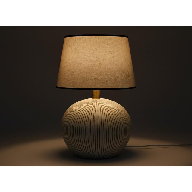 Specifications This large Italian ceramic table lamp from the 1960s brings a strong sculptural presence to any room. The...