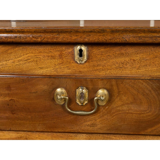 An English walnut flip top sideboard from the 19th century with faux drawers, four lower ones and reeded side posts....
