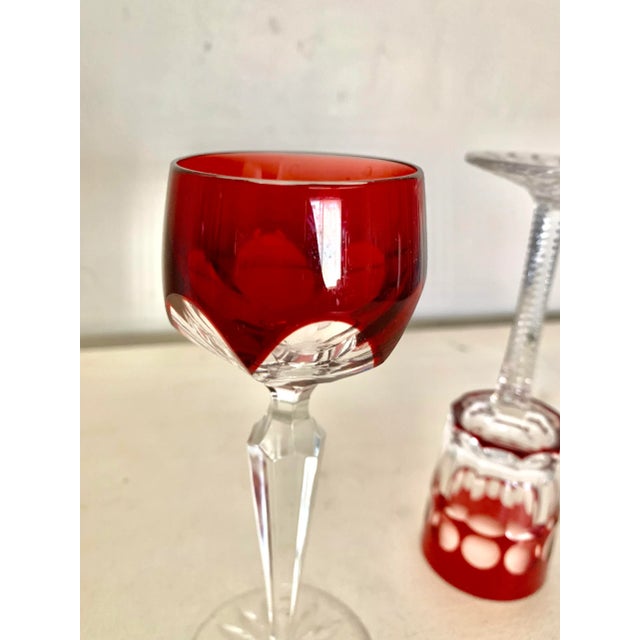 Serve your favorite liqueur in style in these hand cut Faberge red crystal glasses! Made if two layers of crystal, the...