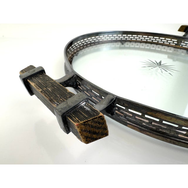 A refined mid-century gallery tray featuring a pierced silverplate rim with a softly aged patina and contrasting dark wood...