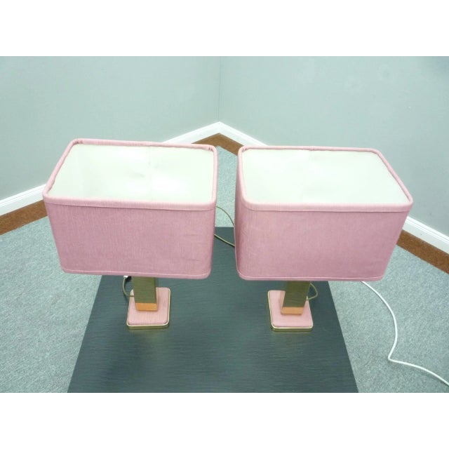 Beautiful table lamps from the 1960s. Material brass and pink fabric. High quality manufactured and fully functional. The...