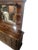 A substantial late-20th-century rustic dresser distinguished by its warm brown finish, architectural paneled details,...