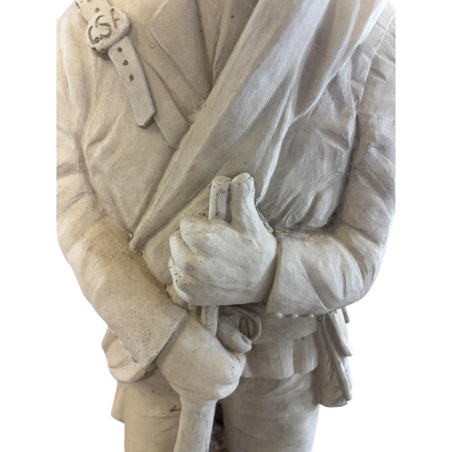 A vintage cast stone sculpture depicting a standing Confederate infantry soldier in Civil War-era uniform, rendered with...