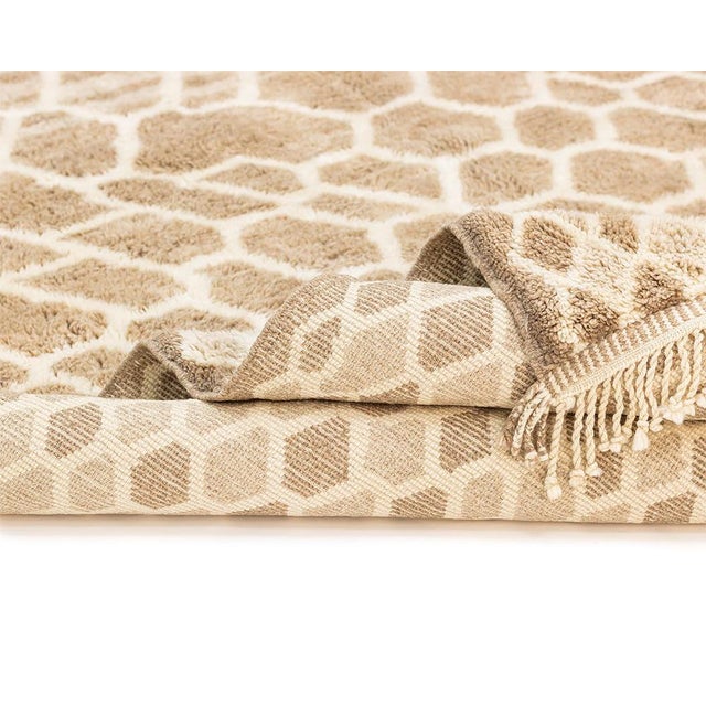 Elevate your interior with this 406 x 309 cm hand-knotted Moroccan wool rug, a statement piece defined by its organic...