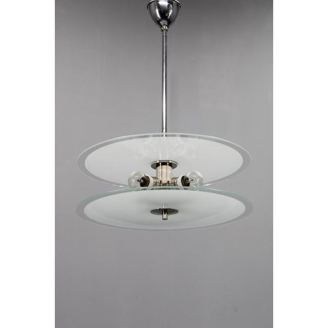 Rare 1930s bauhaus chandelier produced in czechoslovakia. This functionalist ceiling light features a clean architectural...