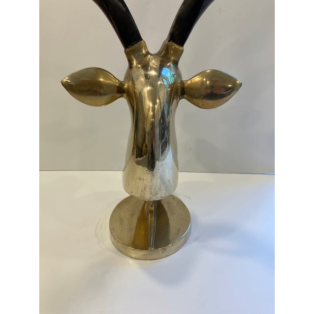 This highly stylized sculpture of a gazelle was inspired bythe Art Deco period. The solid brass head is accentuated with...