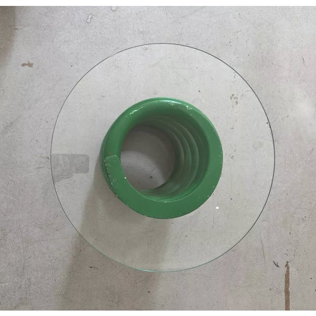 Vintage Green Space Age side table. The table leg is a green cast iron spring supporting a circular glass top. In good...