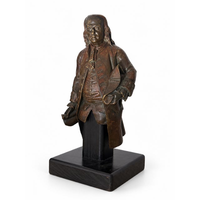 A distinguished early 19th century gilt bronze portrait sculpture of Benjamin Franklin, circa 1830s, presented on a dark...