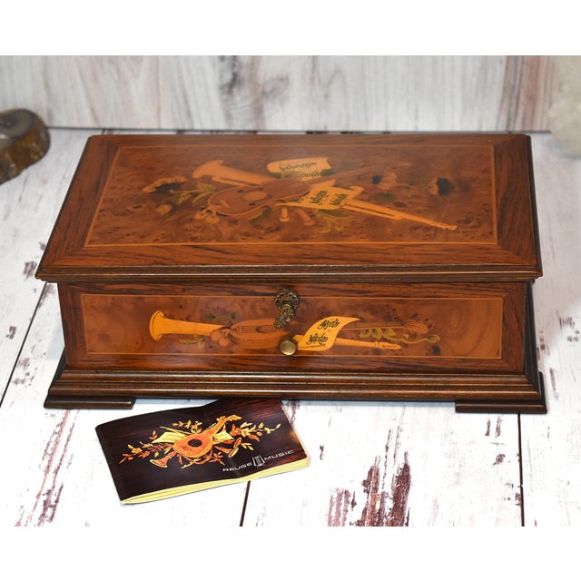 Swiss Reuge Music Box 3 Songs Inlaid Box With Key This box is beautifully inlaid with sheet music, musical instruments and...