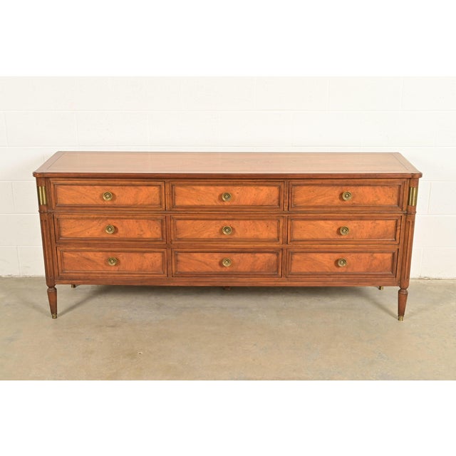 A gorgeous French Regency Louis XVI or Neoclassical style nine-drawer dresser or credenza By Baker Furniture USA, Circa...