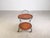 We are offering for sale a beautiful small serving cart from the 1960s. This small side table features two removable teak...