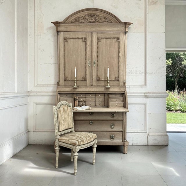Rare and exceptional late 18th century Dutch Neoclassical secretary bookcase crafted in oak and expertly stripped to...