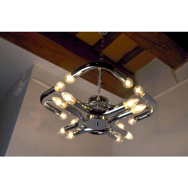 Superb and rare Goffredo Reggiani chandelier designed and produced in Italy in the 1970s. This chandelier is composed of 8...