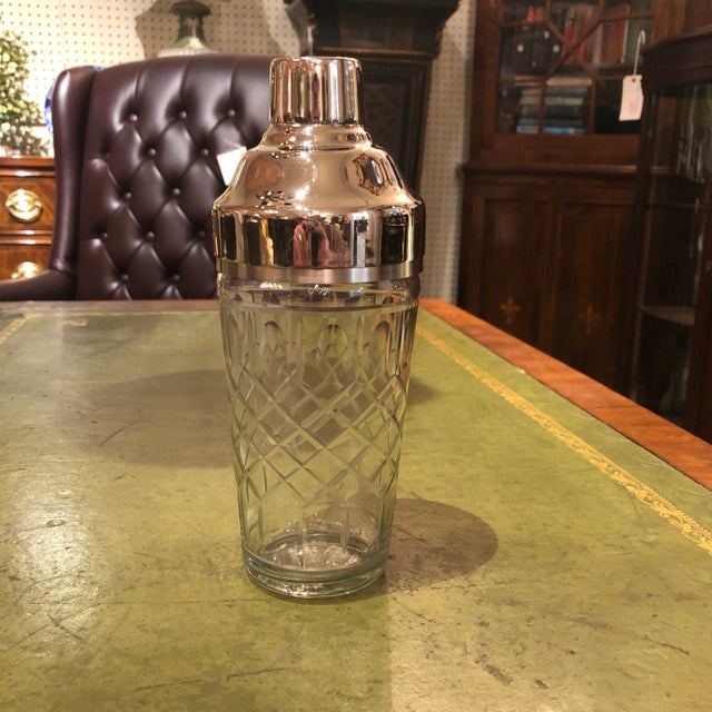 Very Nice Cut Crystal Cocktail Shaker With Silverplate Strainer and lid. Cut diamond pattern with thumbprint oval around top.