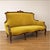 Early 20th-century Art Nouveau sofa, crafted from solid walnut and recently reupholstered in mustard-colored velvet. Its...