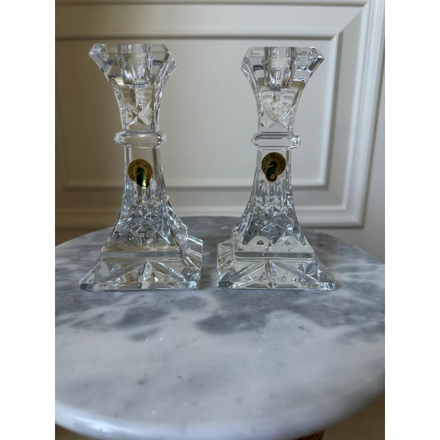 Beautiful elegant pair of Waterford crystal candlesticks, dating to the 1970’s. Waterford stickers still attached. Each...