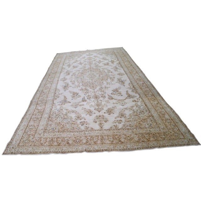 Hand-knotted with care using traditional rug-making techniques, this wool rug blends timeless craftsmanship with a modern...