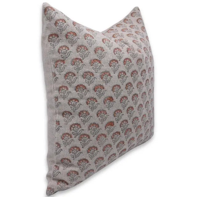 Bring a sense of timeless beauty to your home with this handmade block print cushion cover, showcasing the delicate charm...