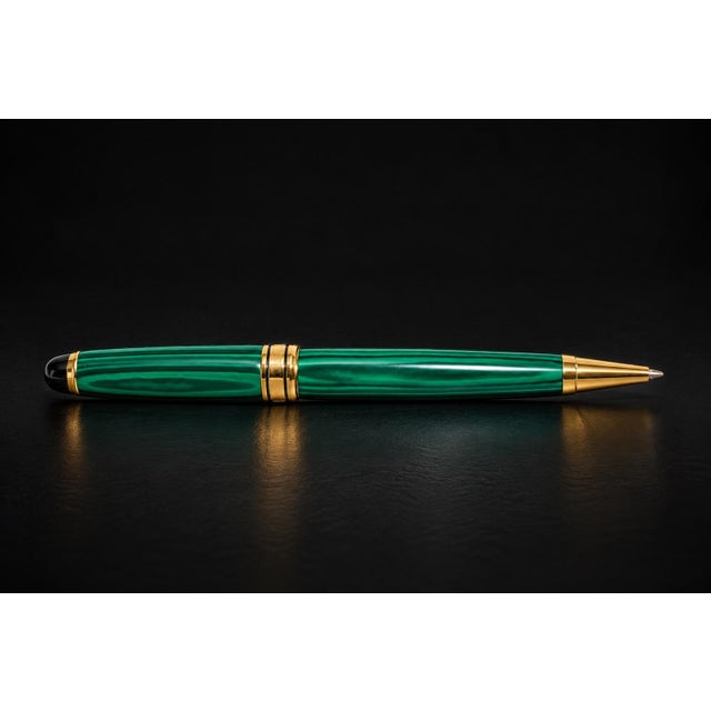 A handsome ballpoint pen crafted from genuine malachite, distinguished by its rich emerald-green color and mesmerizing...