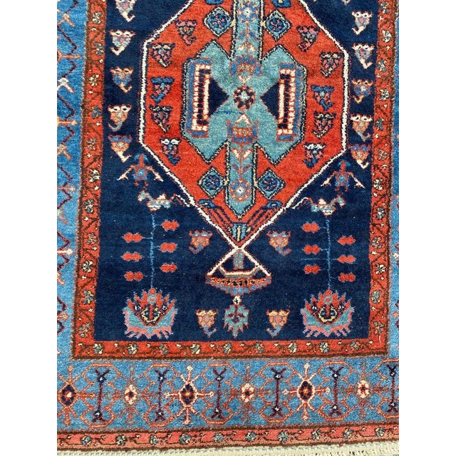 Very beautiful long rug with nice geometrical and tribal design, entirely hand knotted with wool velvet on cotton foundation.