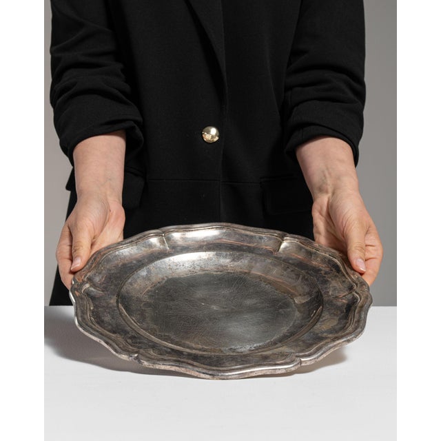 This mid 20th century plate from France is finished in silver. Its form follows honest, well-proportioned lines typical of...