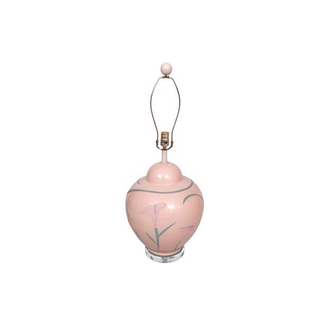 A ginger jar shaped glass table lamp painted in pink. Decorated with the simple form of the elegant calla lily, known for...