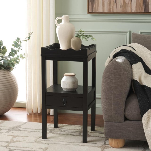 Elevate your space with the Darlyn One Drawer Accent Table in a serene matt black color. This versatile piece features a...