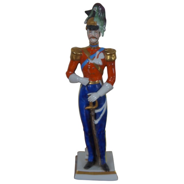 Set of three hand painted German porcelain soldier figurines standing against pillars, likely by A.J. Uffrecht & Company,...