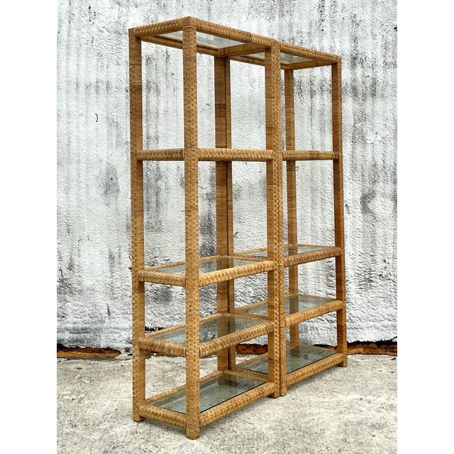 Bring an air of breezy sophistication to your space with this stunning pair of vintage woven rattan etageres. Their open,...