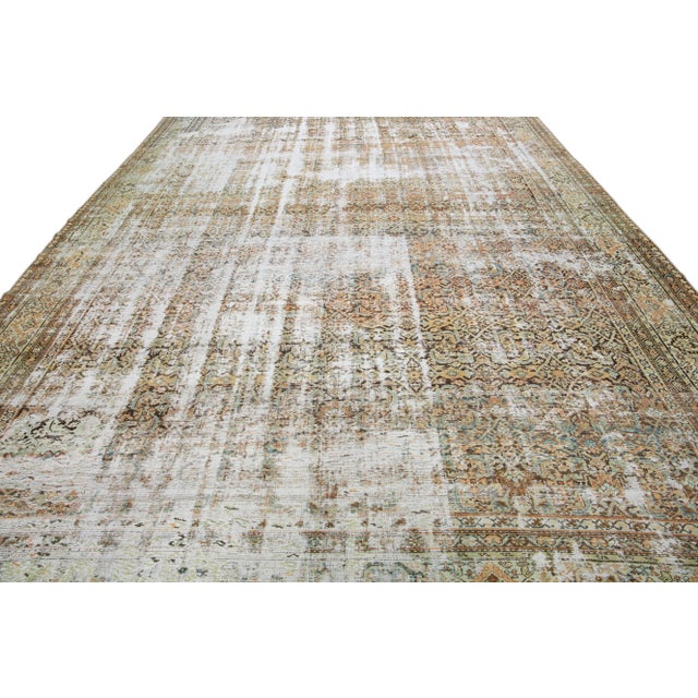 Beautiful antique Malayer hand-knotted wool rug with a brown field. This Malayer piece has a multicolor accent in a...