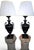 An impressive and highly decorative pair of Art Deco lamps dating from the early 20th century, featuring elegant black-...