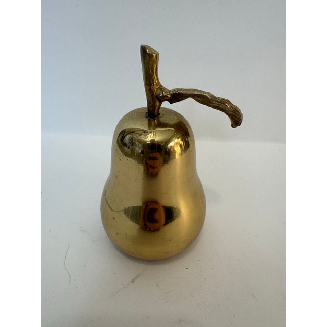 Add a touch of timeless warmth to your decor with this charming vintage brass pear bell. A perfect blend of functional...