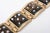 This is part of Chairish’s Costume Jewelry assortment. White enamel dots overlay the brown enamel in this vintage cuff...