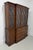 A Traditional style breakfront china display cabinet by Henkel Harris, of Winchester, Virginia, USA. Mahogany with brass...