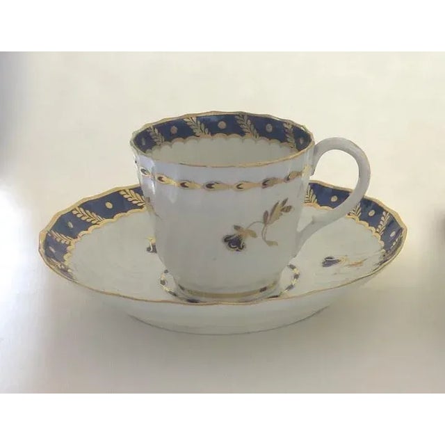 Set of four early English porcelain cups and saucers by Bow. Cobalt and gilt decoration. Circa 1780. Diameter saucer is 5...
