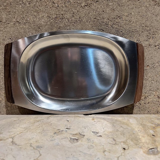 AMBIANIC presents 1970s Teak Stainless Tray from Denmark stamped from Denmark. 13.75 w x 8.5 d x 1 h preowned original...