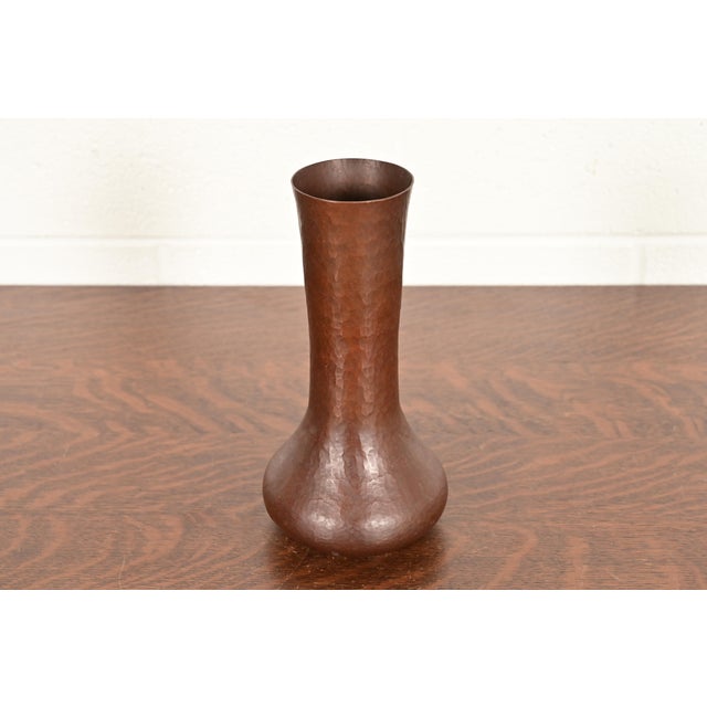 A gorgeous Arts & Crafts hand hammered copper vase In the manner of Roycroft By Ramon Ramirez Mexico, Mid-20th Century...