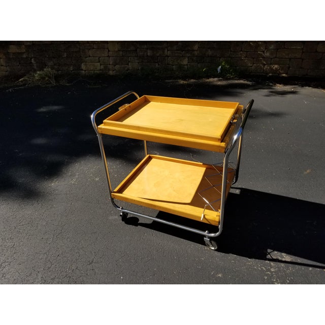 Wonderful blond and chrome mid-century bar cart. Well made, functional and in excellent condition. Cocktails at your place!