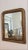 A 19th Century French Louis Philippe mirror with a gilded wooden frame, featuring the period’s characteristic rounded...