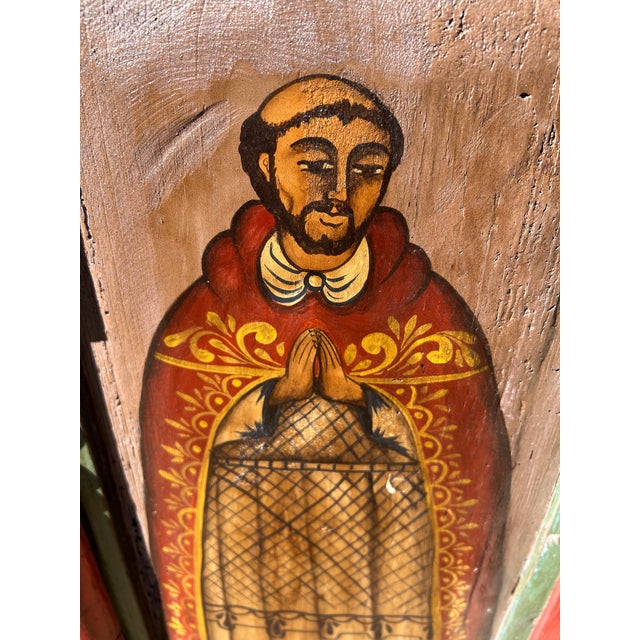 Eye catching colorful folk art rendering of a religious icon in typical Mexican primitive style on reclaimed wood and...