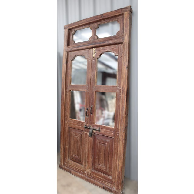 Our Transom Double Door with Mirrored Glass is solid teak, a unique one-of-a-kind piece. Hand-crafted featuring double...