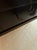 Made from dark hardwood with a beautiful gold metallic top, this console table also features two drawers for maximum...