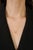This pendant necklace features a 0.42 carat oval-cut yellow diamond, set in 18K yellow gold. The diamond measures...