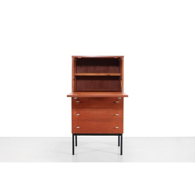 A beautiful secretary designed by Pierre Guariche for Meurop in Belgium. This cabinet features a flap with a shelf and...